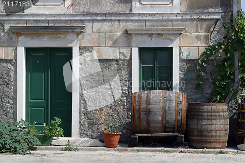 Image of Barrels in front of house