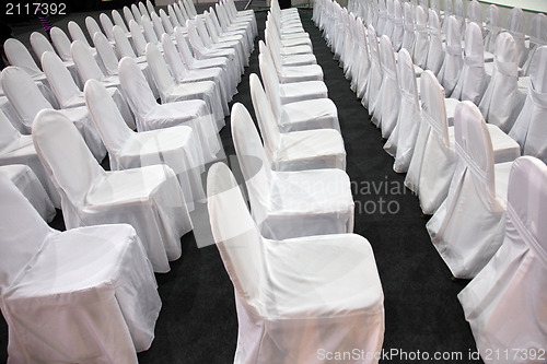 Image of Rows of white chairs