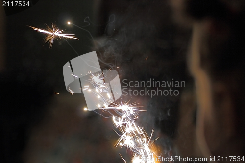 Image of sparkles over dark background
