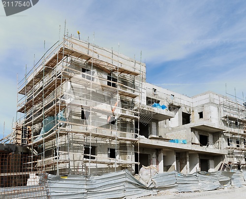 Image of Three-storeyed apartment building under construction