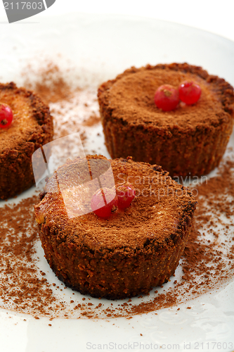 Image of Small chocolate cake with curd cream.