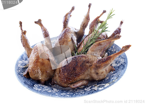 Image of four quails baked