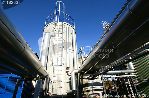 Image of Industrial zone, Steel pipelines and valves against blue sky