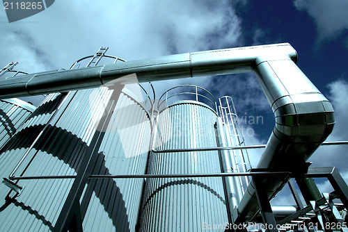 Image of Industrial zone, Steel pipelines and valves against blue sky