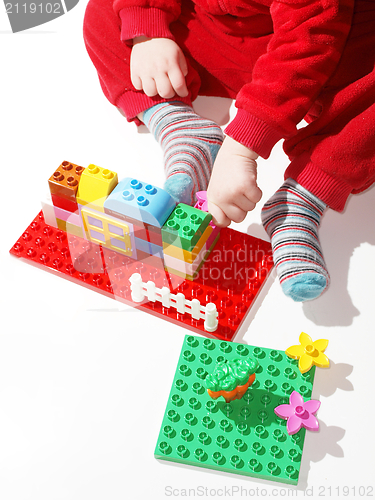 Image of Toddler playing building toys