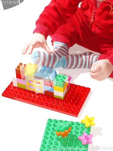 Image of Toddler playing building toys