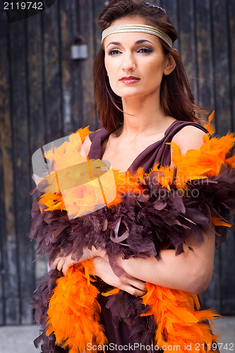 Image of girl in brown and orange boa