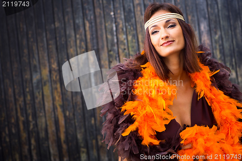Image of girl in brown and orange boa
