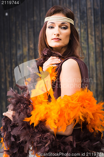 Image of girl in brown and orange boa