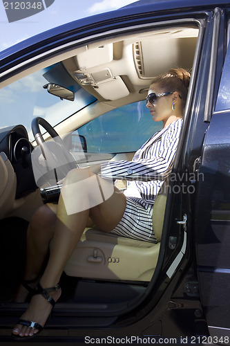 Image of smart woman in the car