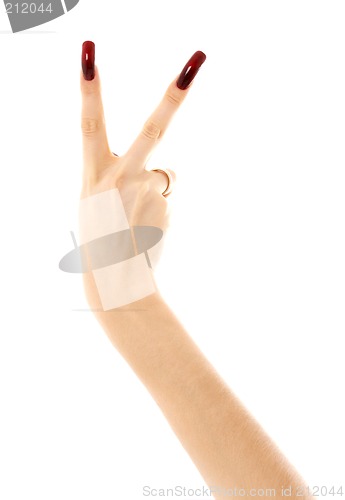 Image of hand with long acrylic nails showing victory sign