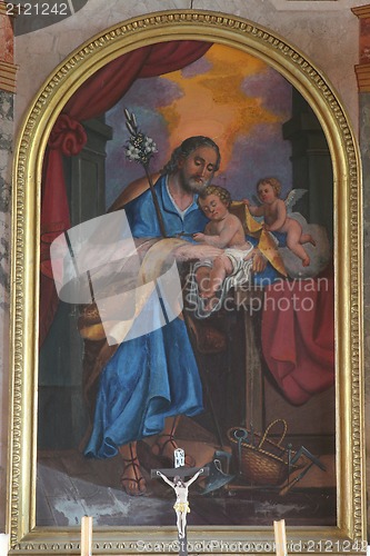Image of Saint Joseph holding baby Jesus