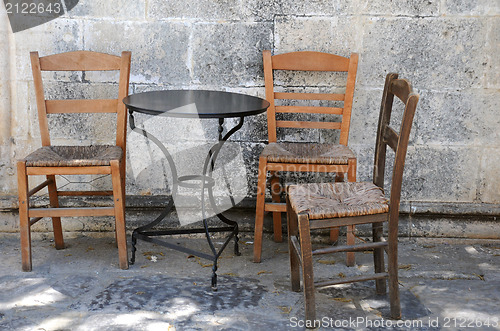 Image of Three Old Chairs and One Table