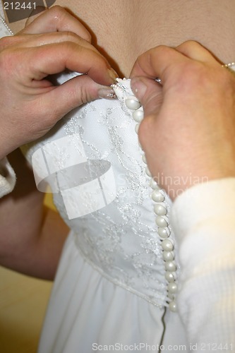 Image of Buttoning the Bride