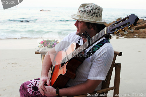 Image of Musician on the beach