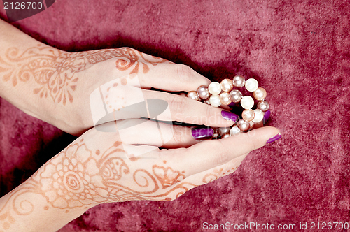 Image of Henna art on woman's hand