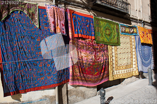 Image of Colorful fabrics in the street 