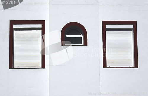 Image of three windows on a wall