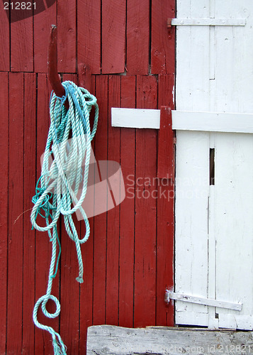 Image of Green rope on a wooden building