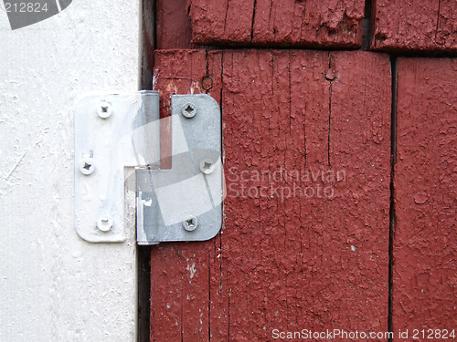 Image of Old hinge on a wooden door