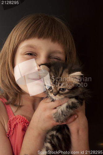 Image of child with a kitten