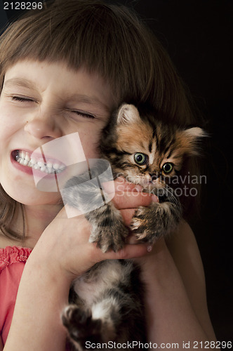 Image of child with a kitten