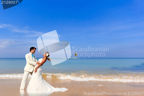 Image of beautiful couple on the beach