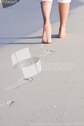 Image of barefoot in the sand in summer holidays