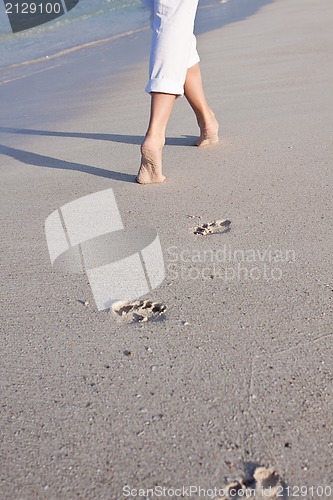 Image of barefoot in the sand in summer holidays