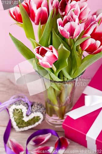 Image of pink and white tulips present ribbon easter birthday