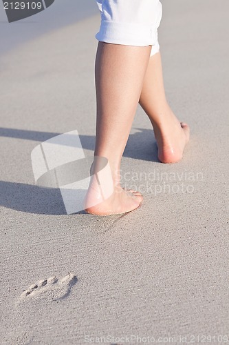 Image of barefoot in the sand in summer holidays