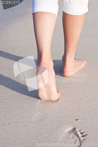 Image of barefoot in the sand in summer holidays