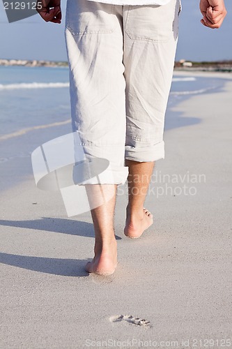 Image of barefoot in the sand in summer holidays