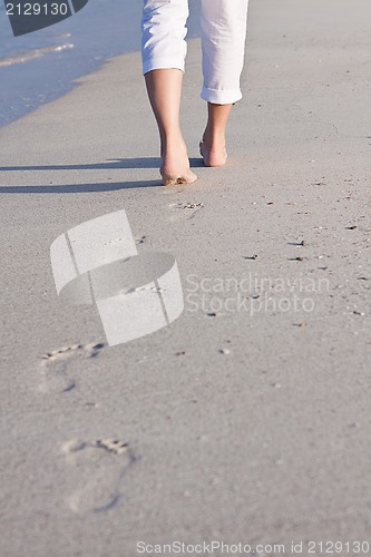 Image of barefoot in the sand in summer holidays