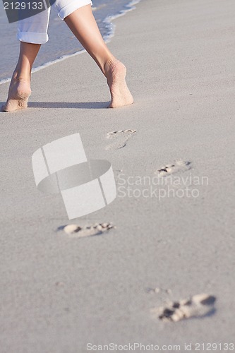 Image of barefoot in the sand in summer holidays