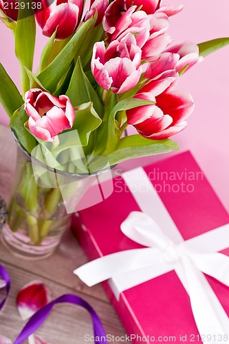 Image of pink and white tulips present ribbon easter birthday