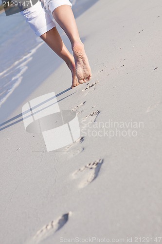 Image of barefoot in the sand in summer holidays