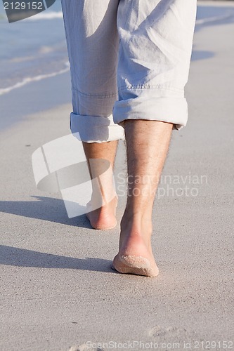 Image of barefoot in the sand in summer holidays