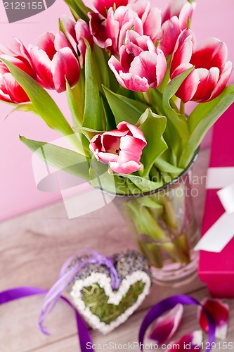 Image of pink and white tulips present ribbon easter birthday