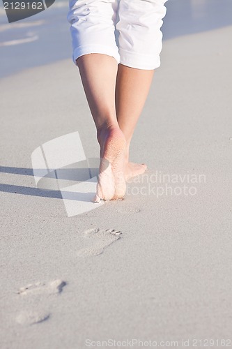 Image of barefoot in the sand in summer holidays