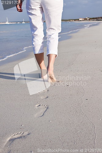 Image of barefoot in the sand in summer holidays