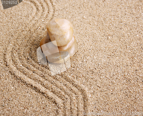 Image of Zen stone in the sand 