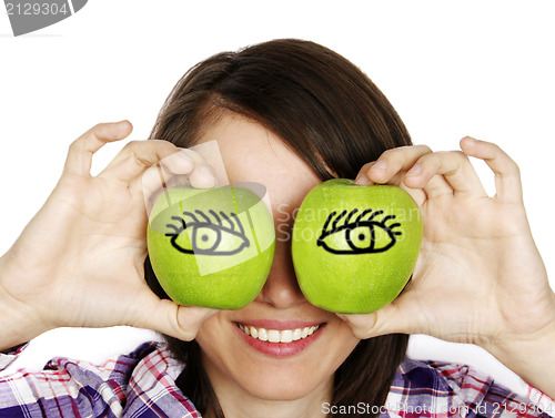 Image of Portret of a girl with two apples