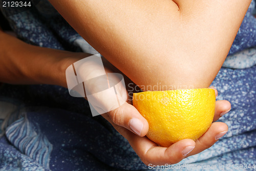 Image of Woman making an elbow treatment