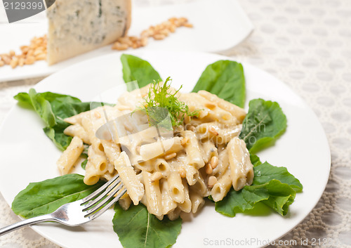 Image of Italian pasta penne gorgonzola and pine nuts