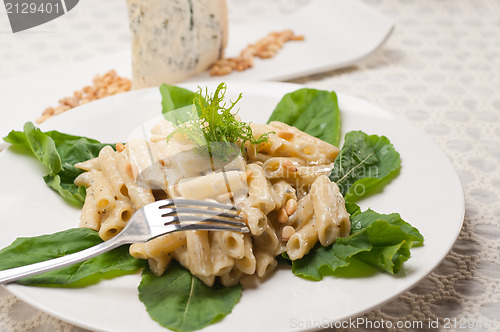 Image of Italian pasta penne gorgonzola and pine nuts