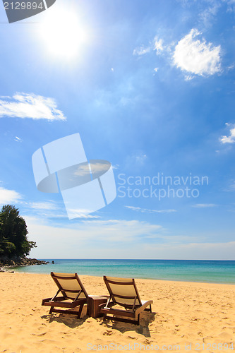 Image of beds and umbrella on a beach