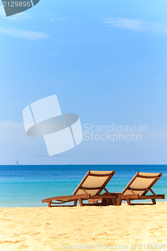 Image of beds and umbrella on a beach