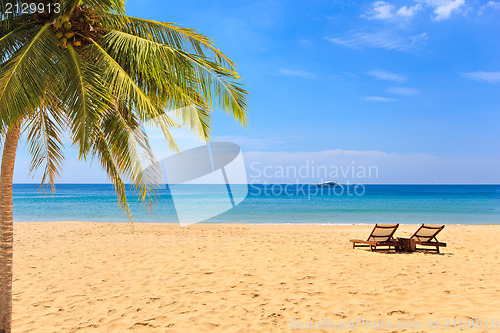 Image of beds and umbrella on a beach