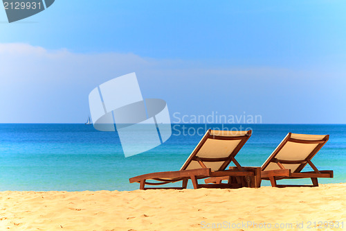 Image of beds and umbrella on a beach